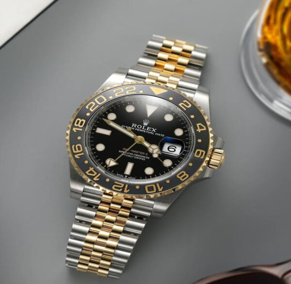 ساعة رجالي رولكس جي إم تي ماستر 2 (Rolex GMT Master II) ذهبي بميناء اسود 40 ملم اوتوماتيك